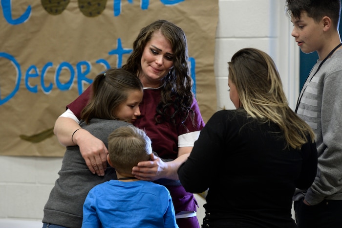 (Scott Sommerdorf   |  The Salt Lake Tribune)   Inmate Dianna Robles says goodbye to her children Brooklyn, left, Cameron, center, and Demitrie, right, at the end of "Kids Day" at the Utah State Prison, Saturday, October 7, 2017.