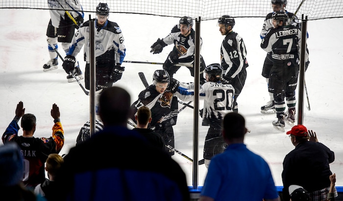 (Steve Griffin  |  The Salt Lake Tribune) Fans get into the action as they net to the boards during the Utah Grizzlies versus Idaho Steelheads game at the Maverik Center in West Valley City Monday Feb. 19, 2018.