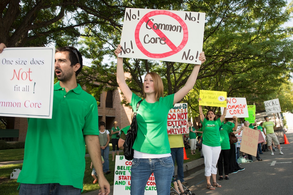 (Rick Egan | The Salt Lake Tribune) Opponents of Utah's Common Core protest outside the State Board of Education meeting, Friday, August 8, 2014