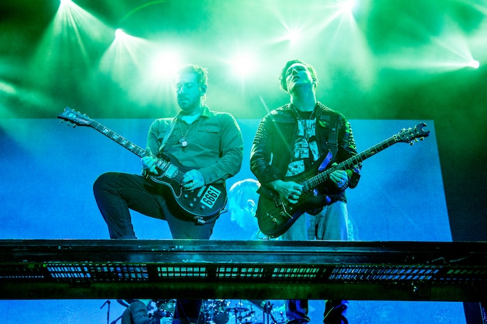 (Photo by Amy Harris/Invision/AP) Avenged Sevenfold guitarist Zacky Vengeance, left, said that while he has never had an official lesson and cannot tune his own guitar, bandmate Synyster Gates, right, is a highly technical performer well-versed in music theory.