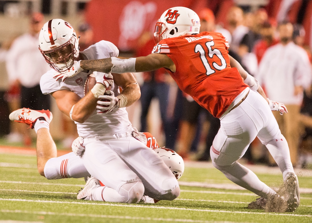 (Rick Egan  |  The Salt Lake Tribune)Stanford Cardinal tight end Dalton Schultz (9) is stopped by Utah Utes defensive back Chase Hansen (22) and Utah defensive back Corrion Ballard, in PAC-12 football action, Utah Utes vs. Stanford Cardinals, at Rice-Eccles Stadium, Saturday, October 7, 2017.