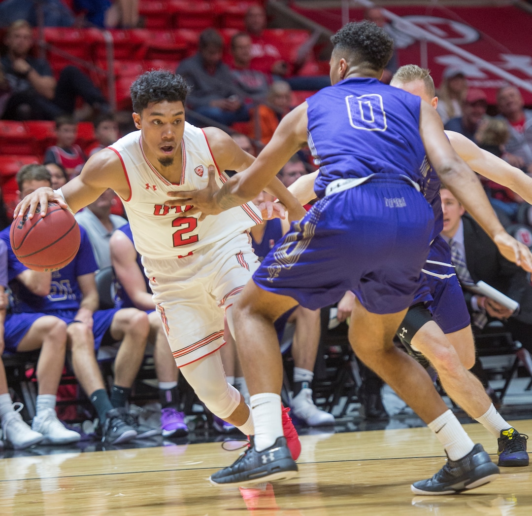 (Rick Egan  |  The Salt Lake Tribune)  Utah Utes guard Sedrick Barefield (2) drives with the ball, as Jalen Galloway (0) College of Idaho, defends, in basketball action, between the Utah Utes and the College of Idaho Yotes at the Jon M. Huntsman Center, Thursday, Nov. 1, 2018.