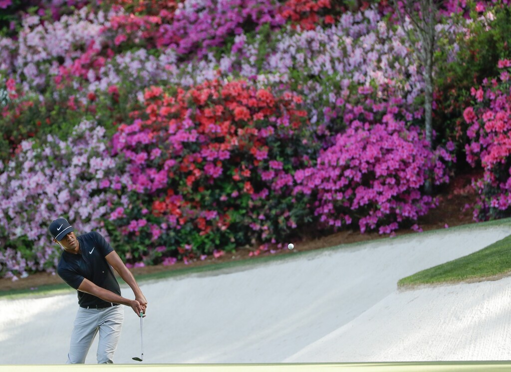 Tony Finau chips to the 13th green during the first round at the Masters golf tournament Thursday, April 5, 2018, in Augusta, Ga. (AP Photo/Matt Slocum)