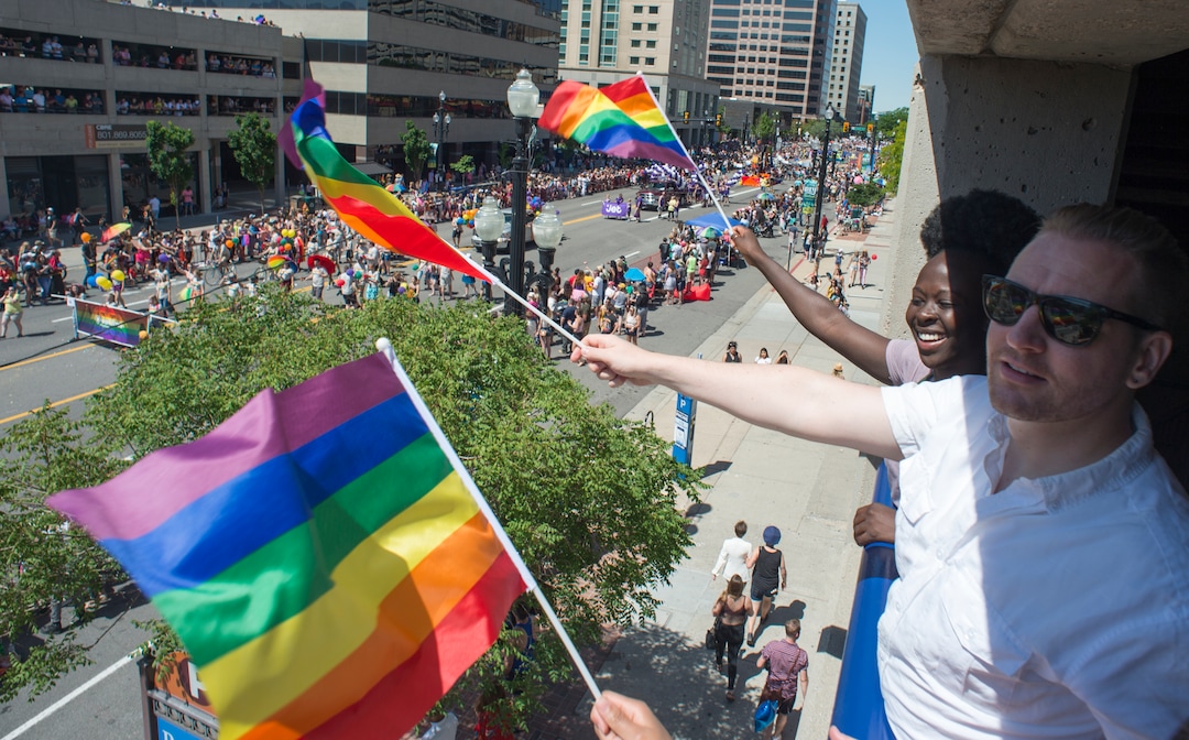 (Rick Egan  |  The Salt Lake Tribune)   Mixsa Kafi and Andrew Izatt wave flags as they watch the Utah Pride Parade, in Salt Lake City, Sunday, June 3, 2018.