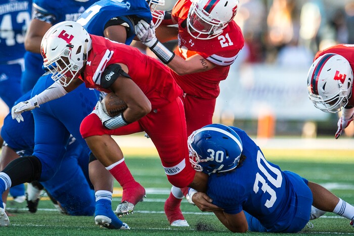 (Chris Detrick  |  The Salt Lake Tribune)  Bingham's Kobi Matagi (30) tackles East's Saia Hamilton (1) during the game at Bingham High School Friday, August 25, 2017. Bingham is winning the game 24-17 at halftime. 