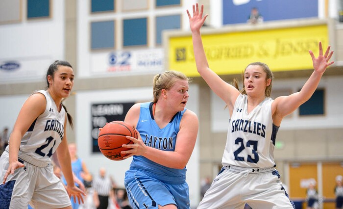 (Trent Nelson | The Salt Lake Tribune)  Layton's Meg Edwards (35) defended by Copper Hills's Laci Olsen (24) and Copper Hills's Breaunna Gillen (23) as Layton faces Copper Hills in the 6A High School Girls' Basketball Tournament at SLCC in Taylorsville, Thursday Feb. 22, 2018.