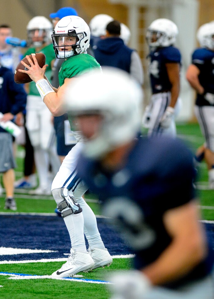 (Steve Griffin  |  The Salt Lake Tribune)  BYU quarterback Beau Hoge runs a play during spring football practice at the indoor practice facility in Provo Thursday March 15, 2018.