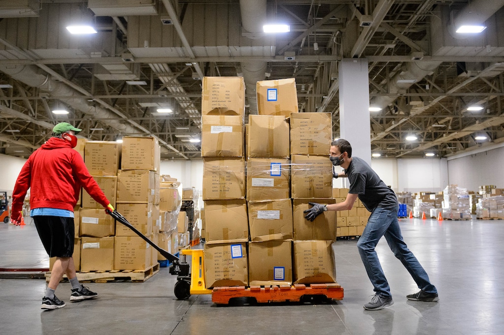 (Trent Nelson | Tribune file photot) Workers organize supplies at the Receiving, Staging and Shipping Center at the Salt Palace Convention Center in Salt Lake City on Friday, May 8, 2020. The center serves as a central location for personal protective equipment received by the State of Utah and sent to hospitals, local health departments and emergency managers.