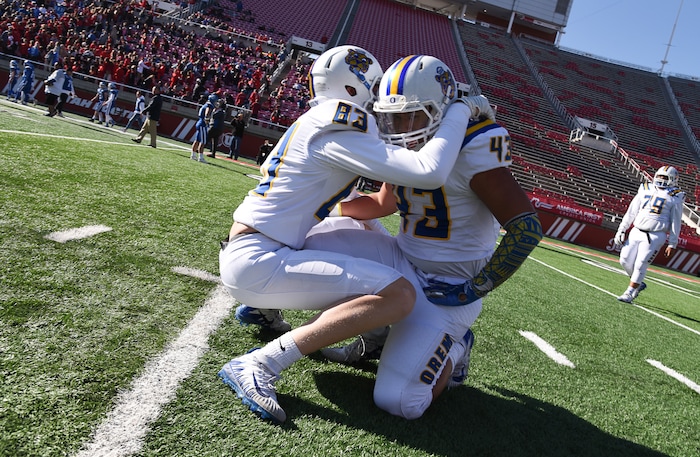 (Francisco Kjolseth  |  The Salt Lake Tribune)  Orem's  Brody Monson and Ben Tuimaseve celebrate after winning the 4A high school championship game against Dixie at Rice-Eccles Stadium in Salt Lake City, Friday, Nov. 16, 2018. 