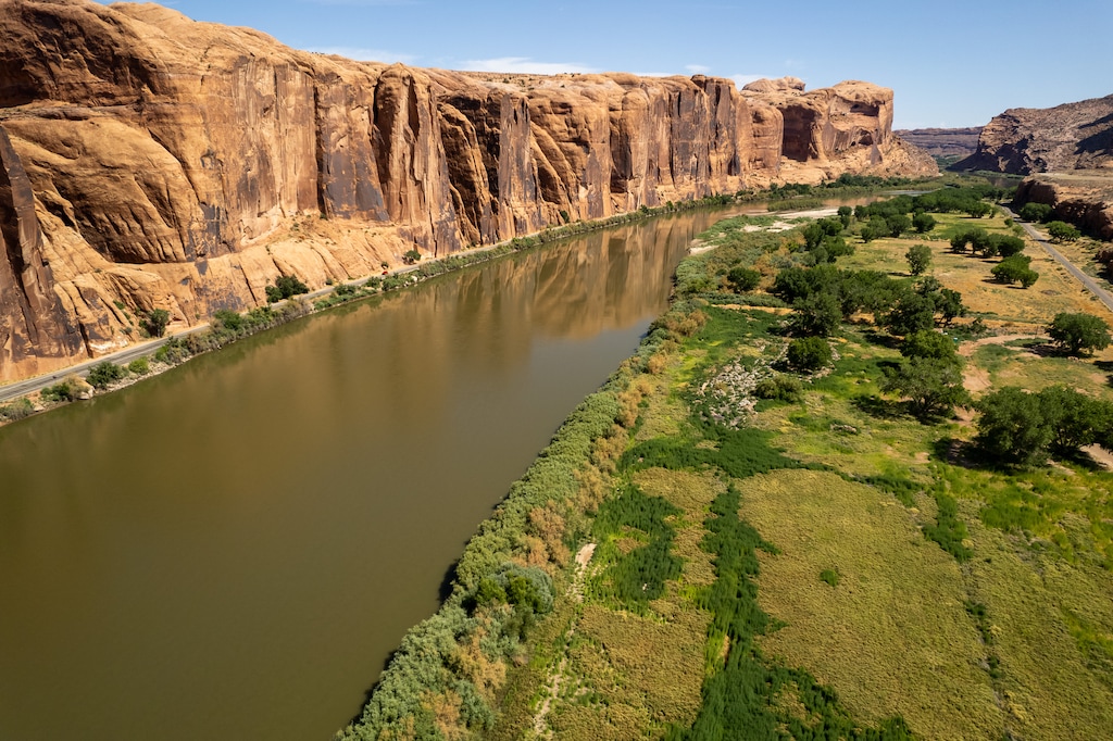 (Trent Nelson | The Salt Lake Tribune) The Colorado River flows next to Kane Creek Boulevard in Moab on Thursday, July 27, 2023.