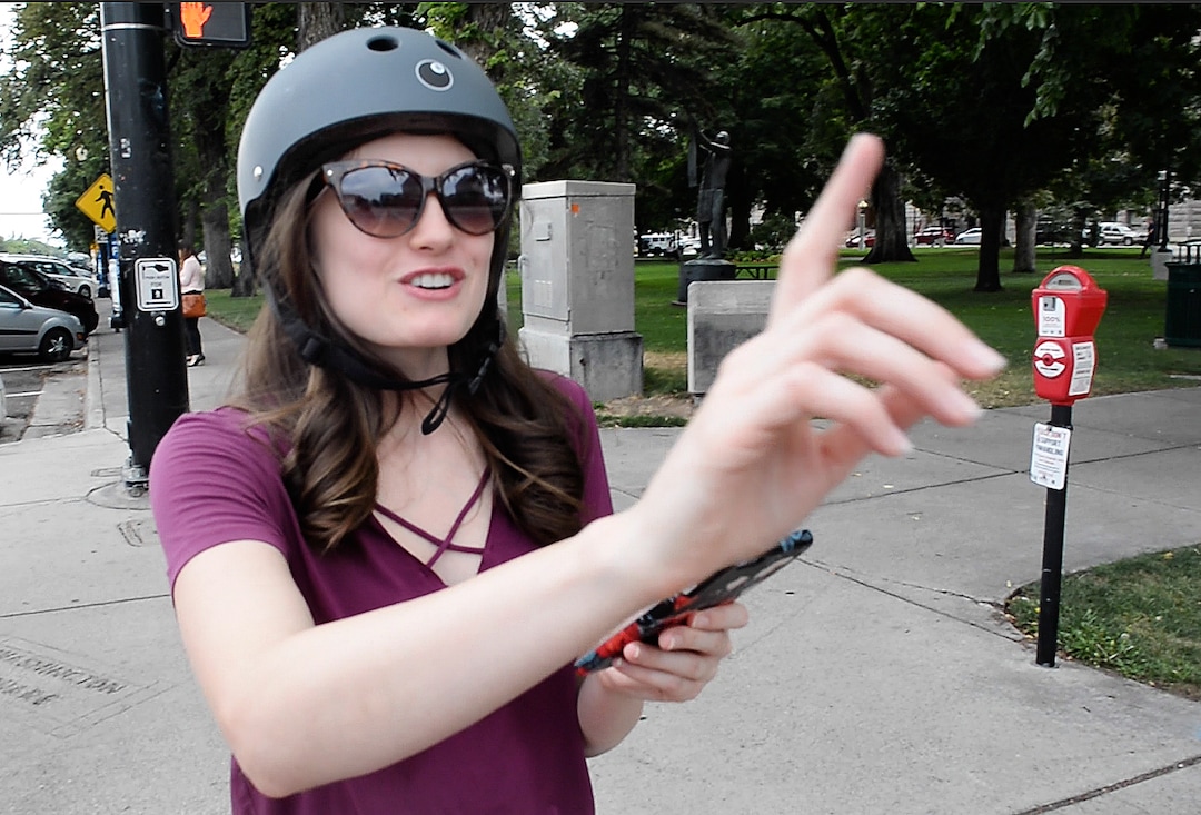 (Rick Egan  |  The Salt Lake Tribune)       Salt Lake Tribune reporter Taylor Stevens searches for a Bird scooter, at the start of a race against colleagues from Library Square to the Tribune building at the Gateway on Thursday, Aug. 2, 2018. 
