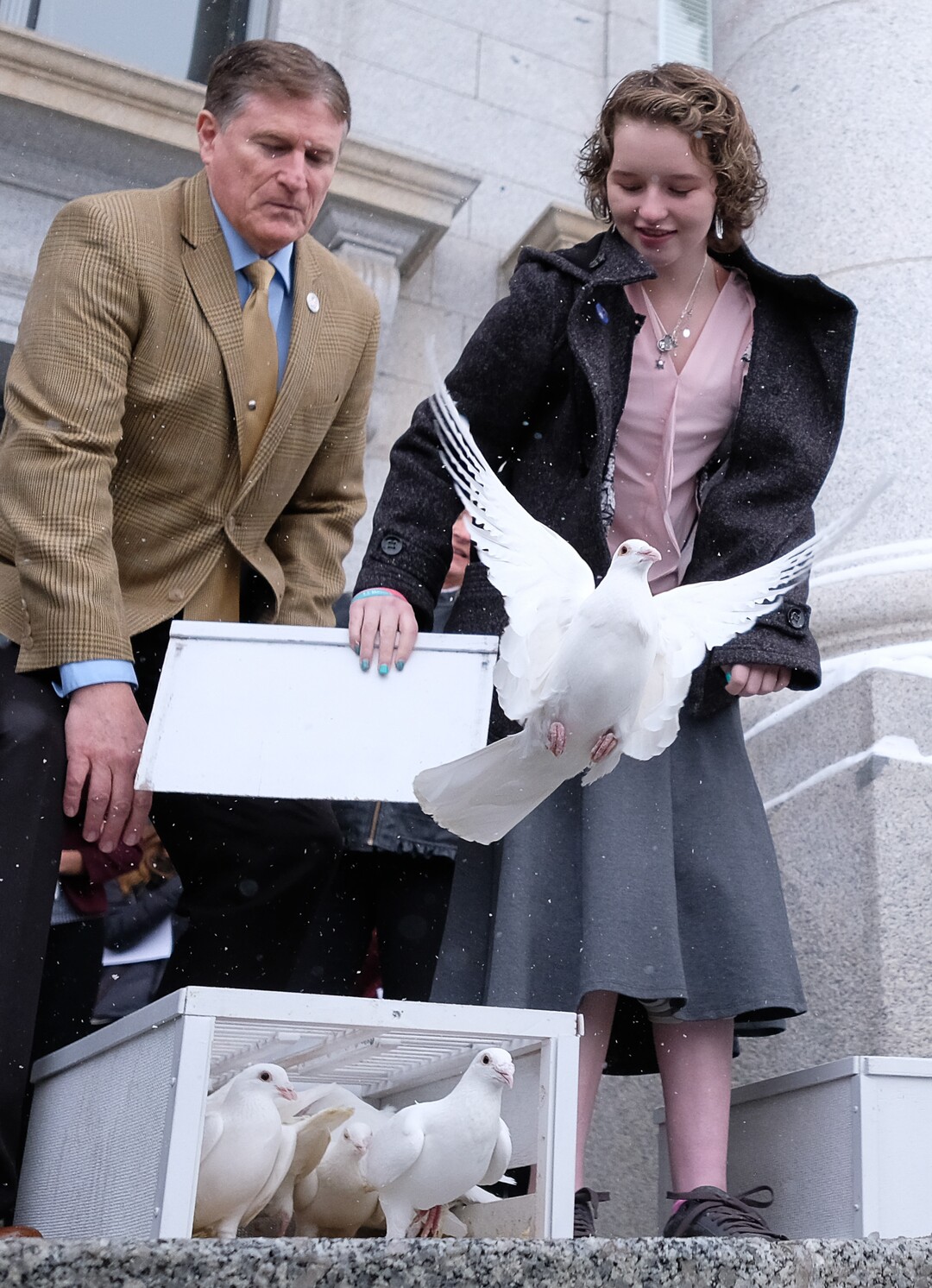 (Francisco Kjolseth  |  The Salt Lake Tribune)  Rep. Val Potter, R-Logan, is joined by Deserae Turner as they release 25 doves on the front steps of the Utah Capitol on Tuesday, Feb. 20, 2018, representing the number of attempts for every suicide death. Turner, a Utah teenage girl who survived being shot in the head by two boys was there to bring attention to bullying and its connection to suicide. 