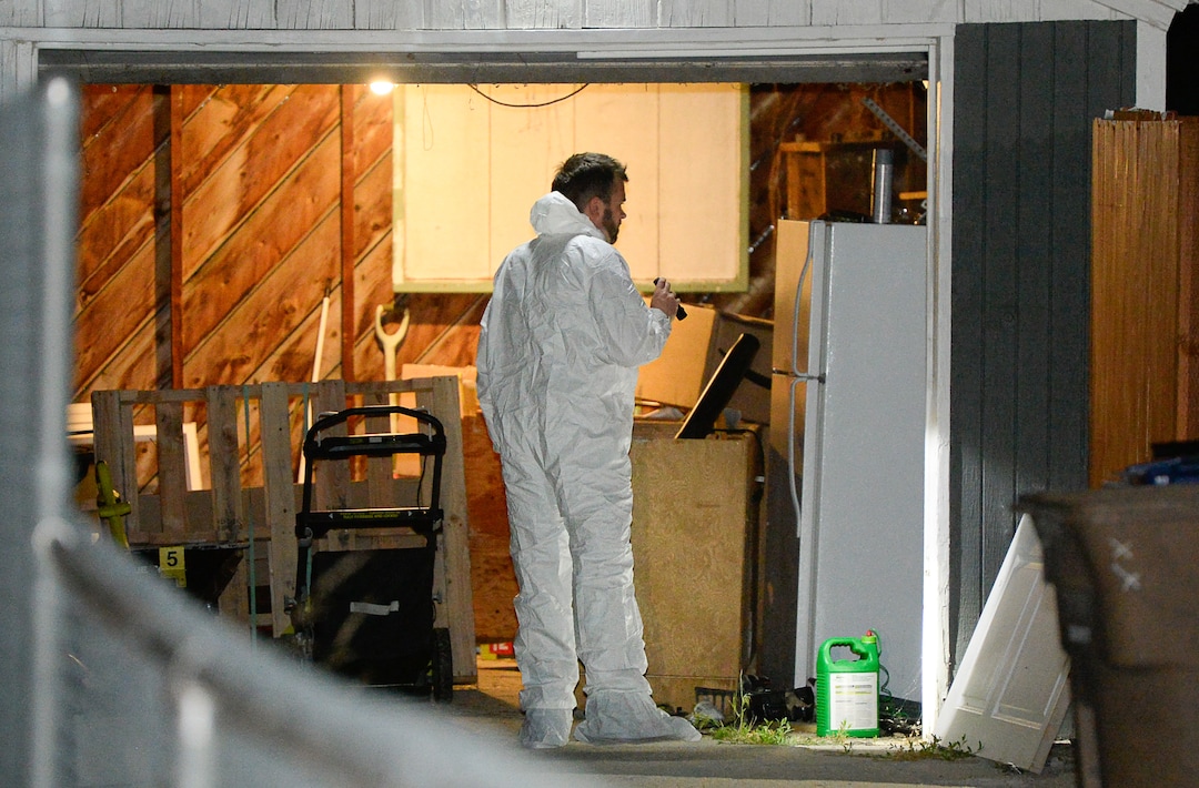 (Francisco Kjolseth  |  The Salt Lake Tribune)  Police investigators search a home at 547 N. 1000 West in Salt Lake City as part of the disappearance of University of Utah student MacKenzie Lueck on Wed. June 26, 2019.