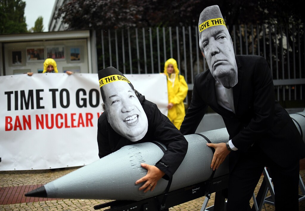 (Britta Pedersen/dpa via AP) In this Sept. 13, 2017, file photo, activists of the International Campaign to Abolish Nuclear Weapons (ICAN) protest against the conflict between North Korea and the USA with masks of the North Korean ruler Kim Jong Un, left, and U.S. President Donald Trump, right, in front of the U.S. embassy in Berlin. The International Campaign to Abolish Nuclear Weapons wins the Nobel Peace Prize. The Norwegian Nobel Committee honored the Geneva-based group "for its work to draw attention to the catastrophic humanitarian consequences of any use of nuclear weapons and for its ground-breaking efforts to achieve a treaty-based prohibition of such weapons."