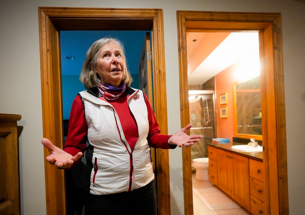 (Bethany Baker | The Salt Lake Tribune) Becky Yih walks through her basement that she has rented to foreign seasonal workers, known as J1s, in her home in Park City on Friday, May 10, 2024. Yih and her husband have rented out their basement for more than a decade but are now considering calling it quits after difficulties with recent tenants.