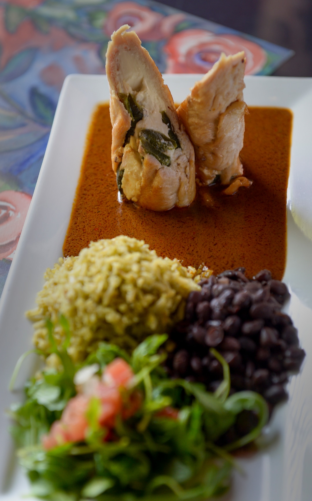 (Leah Hogsten  |  The Salt Lake Tribune)  Pollo rebosado, wrapped chicken with peanut mole sauce, is a new menu item at Rico Cocina y Tequila Bar, formerly Frida Bistro.