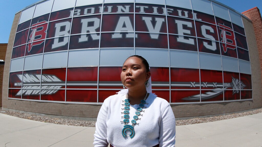 (Rick Bowmer | AP) Lemiley Lane, a Bountiful junior who grew up in the Navajo Nation in Arizona, poses for a photograph at Bountiful High School, July 21, 2020, in Bountiful, Utah. While advocates have made strides in getting Native American symbols and names changed in sports, they say there's still work to do mainly at the high school level, where mascots like Braves, Indians, Warriors, Chiefs and Redskins persist.