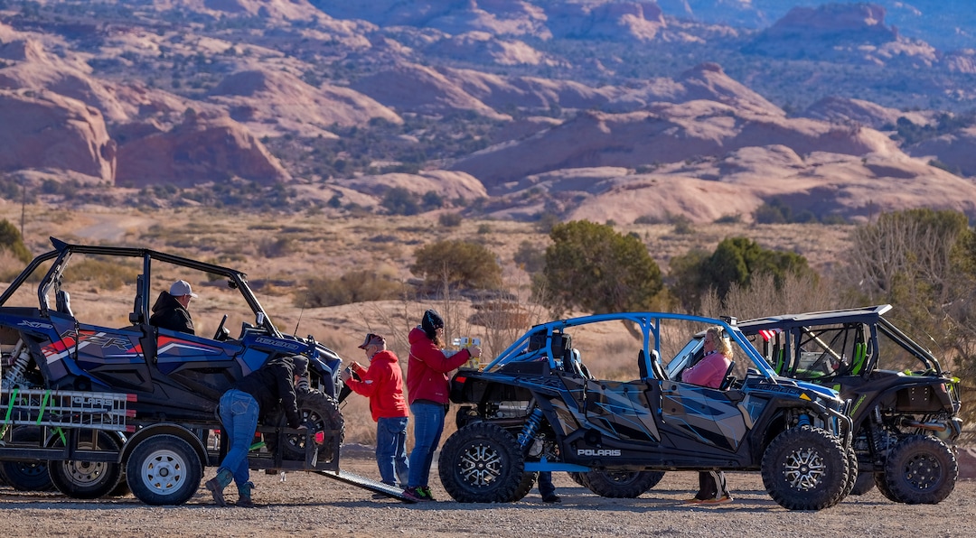 (Leah Hogsten | The Salt Lake Tribune)  Moab residents are thankful for off-highway enthusiasts who drive their machines to Sand Flat Recreation Area trailheads on trailers, like this group at the trailhead to the Fins & Things 4x4 Trail area, Feb. 20, 2021.