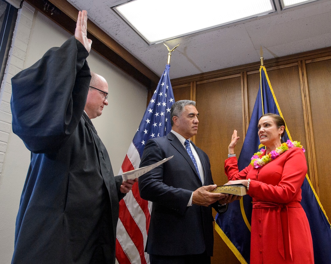 (Steve Griffin  |  The Salt Lake Tribune) As her husband Steve Kaufusi holds the Bible, Michelle Kaufusi takes the Oath of Office, administered by Judge Vernon Romeny, as she becomes the first female mayor in Provo city's history. The small private ceremony was held in the Mayor's Office in Provo Tuesday January 2, 2018.  A public Inauguration Ceremony for Mayor Kaufusi will be held at the Provo Library on January 18, 2018.