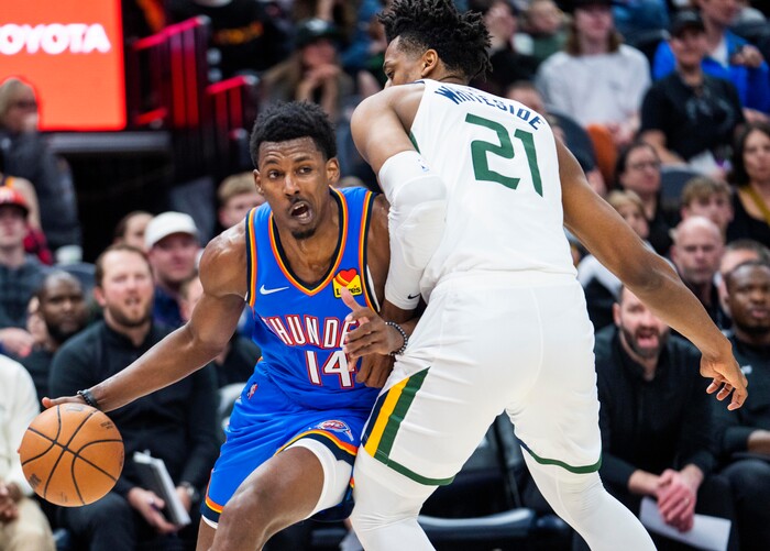 (Rick Egan | The Salt Lake Tribune) Oklahoma City Thunder forward, Jaylen Hoard (14), tries to get past Utah Jazz center Hassan Whiteside (21), in NBA action between the Utah Jazz and the Oklahoma City Thunder at Vivint Arena, on Wednesday, April 6, 2022.
