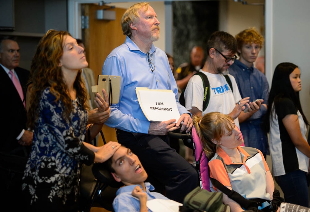 (Trent Nelson | The Salt Lake Tribune)  Protestors at a news conference where a coalition including the LDS Church came out against Utah's medical marijuana initiative, in Salt Lake City on Thursday Aug. 23, 2018.