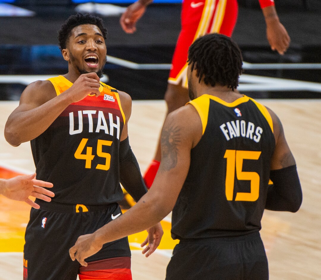 (Rick Egan | The Salt Lake Tribune) Utah Jazz guard Donovan Mitchell (45) and Jazz center Derrick Favors (15), react as the Jazz extend their lead, in NBA action between the Utah Jazz and the Atlanta Hawks at Vivint Arena, on Friday, Jan. 15, 2021.