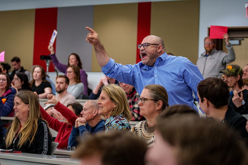 (Trent Nelson | The Salt Lake Tribune) Michael Bretz shouts a question during a joint town hall with U.S. Reps. Celeste Maloy and Mike Kennedy in Salt Lake City on Thursday, March 20, 2025.