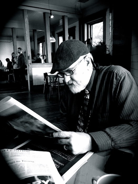 George Pyle, reading The New York Times at The Rose Establishment.