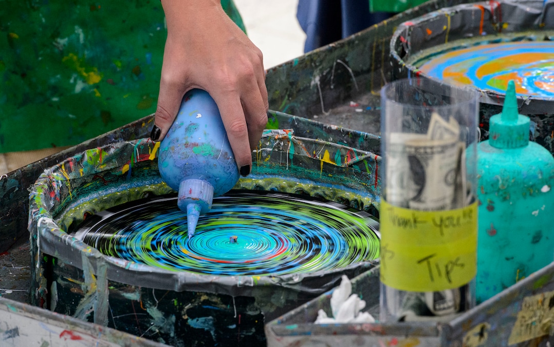 (Steve Griffin  |  The Salt Lake Tribune) People use liquid paints as they make spin art during the Urban Arts Festival at the Gallivan Center in Salt Lake City Sunday September 17, 2017. The two day festival featured artists, music, dance performance, automotive arts, projection art, virtual reality and new media arts.