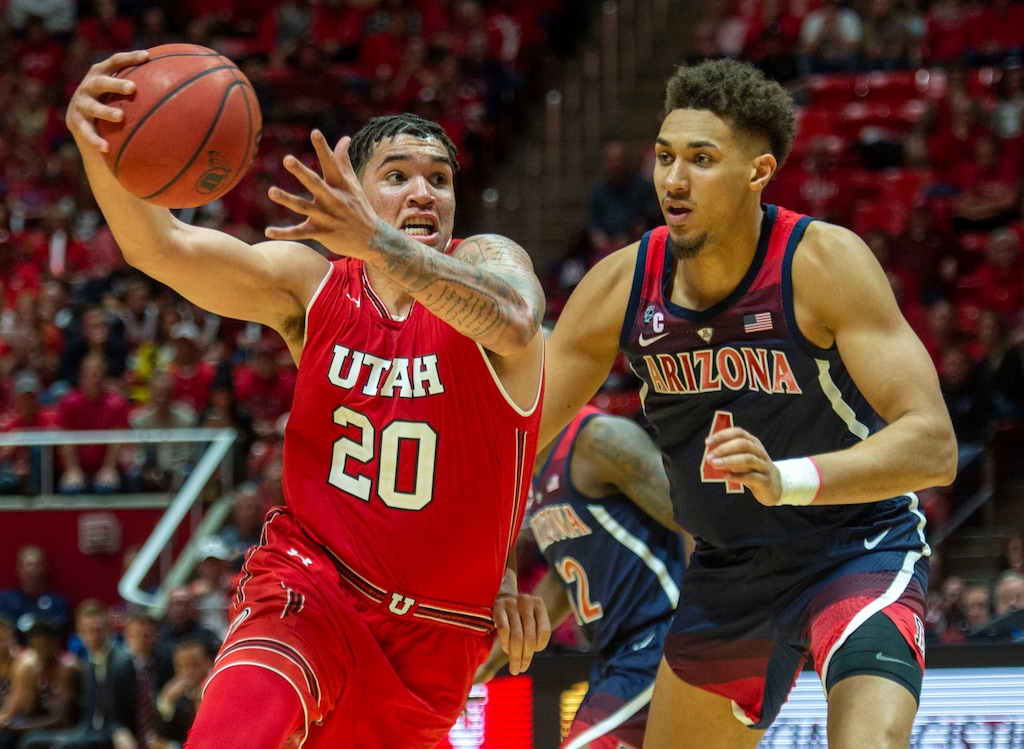 (Rick Egan | The Salt Lake Tribune)      Utah Utes forward Timmy Allen (20) takes the ball inside as Arizona Wildcats center Chase Jeter (4) defends in PAC-12 action between Utah Utes and Arizona Wildcats at the Jon M. Huntsman Center, Thursday, Feb. 14. 2019
