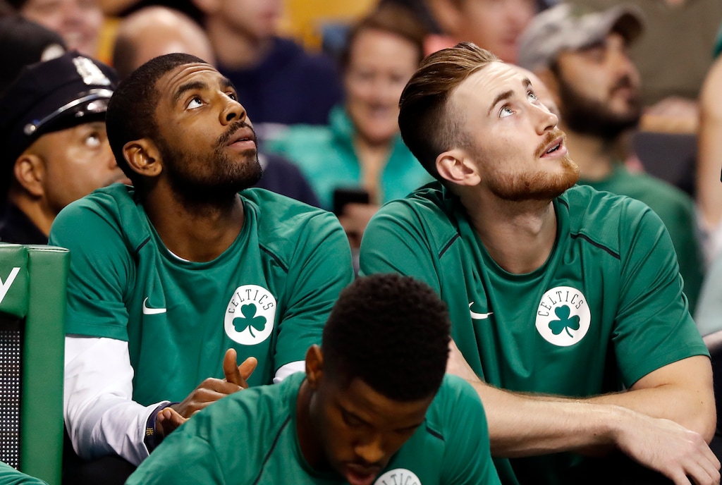 Boston Celtics' Kyrie Irving, left, and Gordon Hayward look on from the bench during the first quarter of a preseason NBA basketball game against the Philadelphia 76ers in Boston, Monday, Oct. 9, 2017. (AP Photo/Winslow Townson)