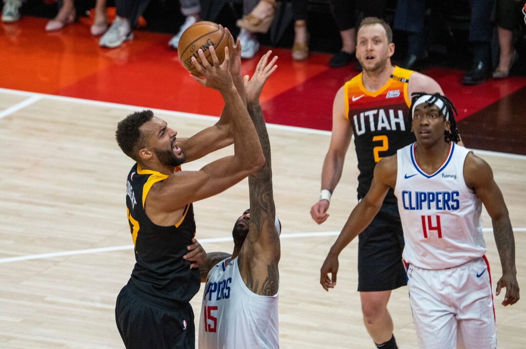 (Rick Egan | The Salt Lake Tribune) Utah Jazz center Rudy Gobert (27) shoots as LA Clippers center DeMarcus Cousins (15) defends, in NBA action between the Utah Jazz and the LA Clippers, in game one in the second round of the NBA playoff series at Vivint Arena, on Tuesday, June 8, 2021.