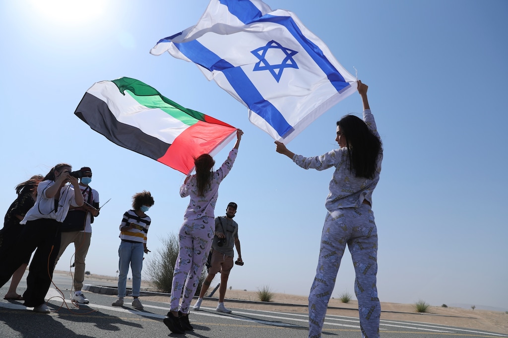 (Kamran Jebreili | AP photo)

Israeli model May Tager, right, holds Israel's blue-and-white flag bearing the Star of David while next to her Anastasia Bandarenka, a Dubai-based model originally from Russia, waves the Emirati flag, during a photo shoot in Dubai, United Arab Emirates, Sunday, Sept. 8, 2020.