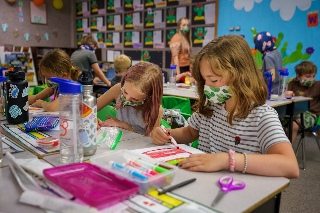 (Trent Nelson | The Salt Lake Tribune) Canyon View Elementary third grade students wear masks in class in Cottonwood Heights on Tuesday, May 18, 2021. Masks won't be mandated in schools this fall, though. And The Tribune wants to know how parents feel about that.