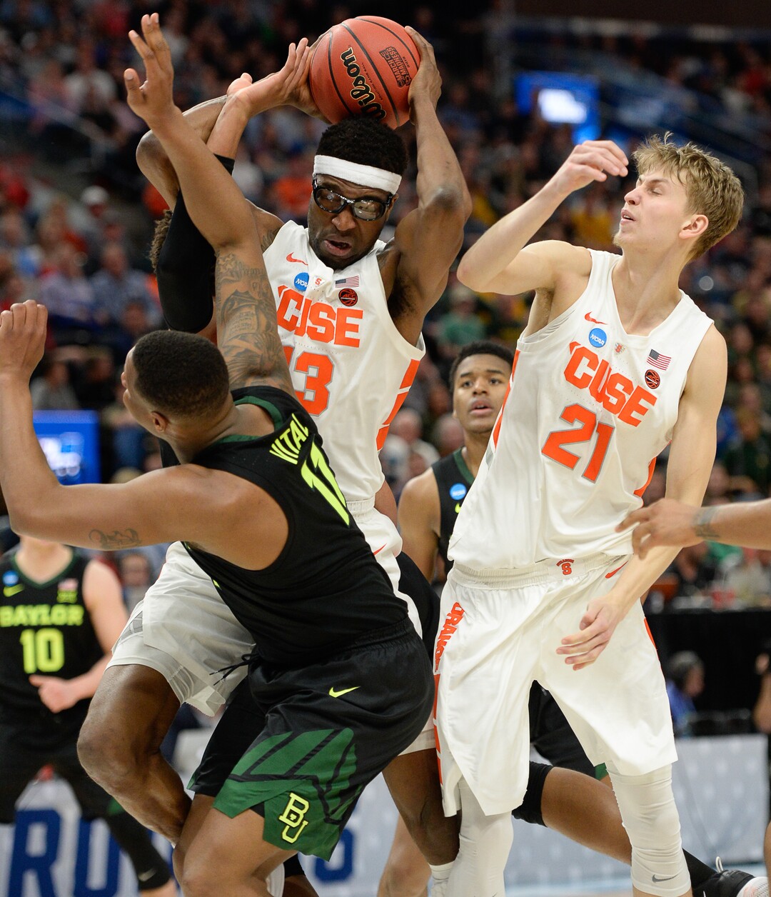 (Francisco Kjolseth  |  The Salt Lake Tribune)  Syracuse Orange center Paschal Chukwu (13) battles the Baylor defense as Syracuse faces Baylor in their first round menÕs NCAA March Madness tournament game at Vivint Smart Home Arena in Salt Lake City on Thursday, March 21, 2019.