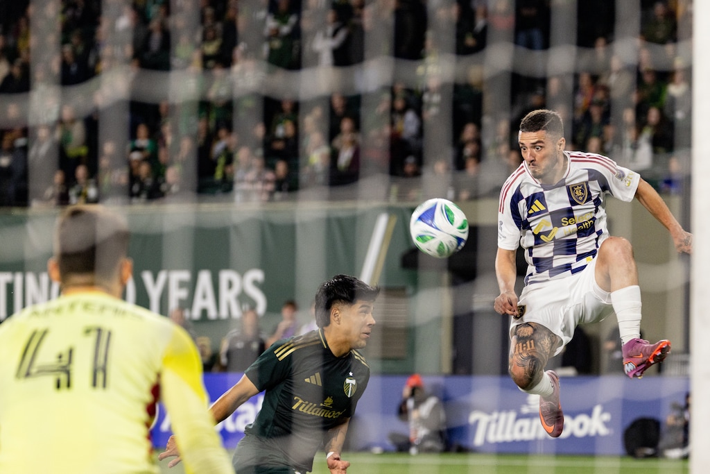 (Howard Lao | AP) Real Salt Lake defender Alexandros Katranis, right, shoots the ball against the Portland Timbers during the second half of an MLS soccer match Wednesday, Oct. 22, 2025, in Portland, Ore.
