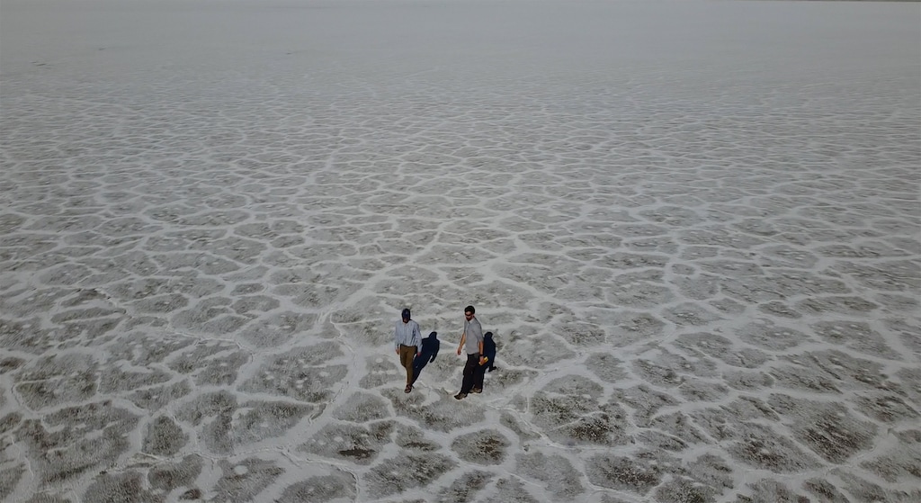 (Rick Bowmer | Associated Press) State of Utah Department of Natural Resources geologists Paul Inkenbrandt, left, and Jeremiah Bernau walk along the Bonneville Salt Flats on Aug. 29, 2022, near Wendover, Utah. The glistening white salt of the world famous area is shrinking near the Utah-Nevada line.