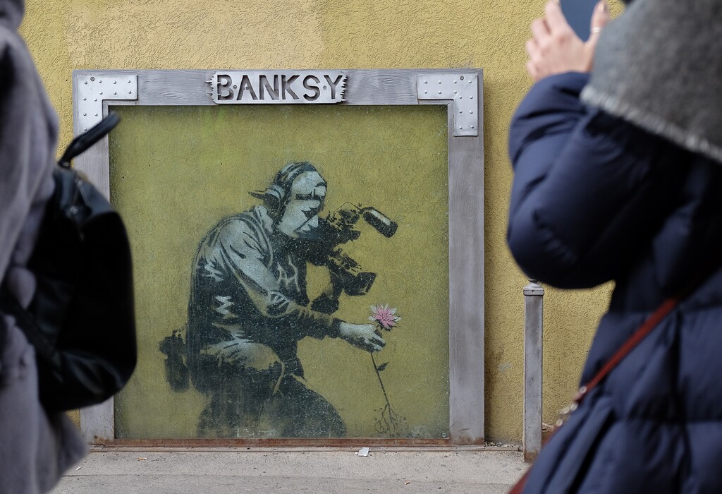 (Francisco Kjolseth | The Salt Lake Tribune File photo) A work of graffiti art by the British street artist Banksy draws attention to a wall along Park City's Old Main Street. A new study says Park City has one of the highest levels of credit-card debt.