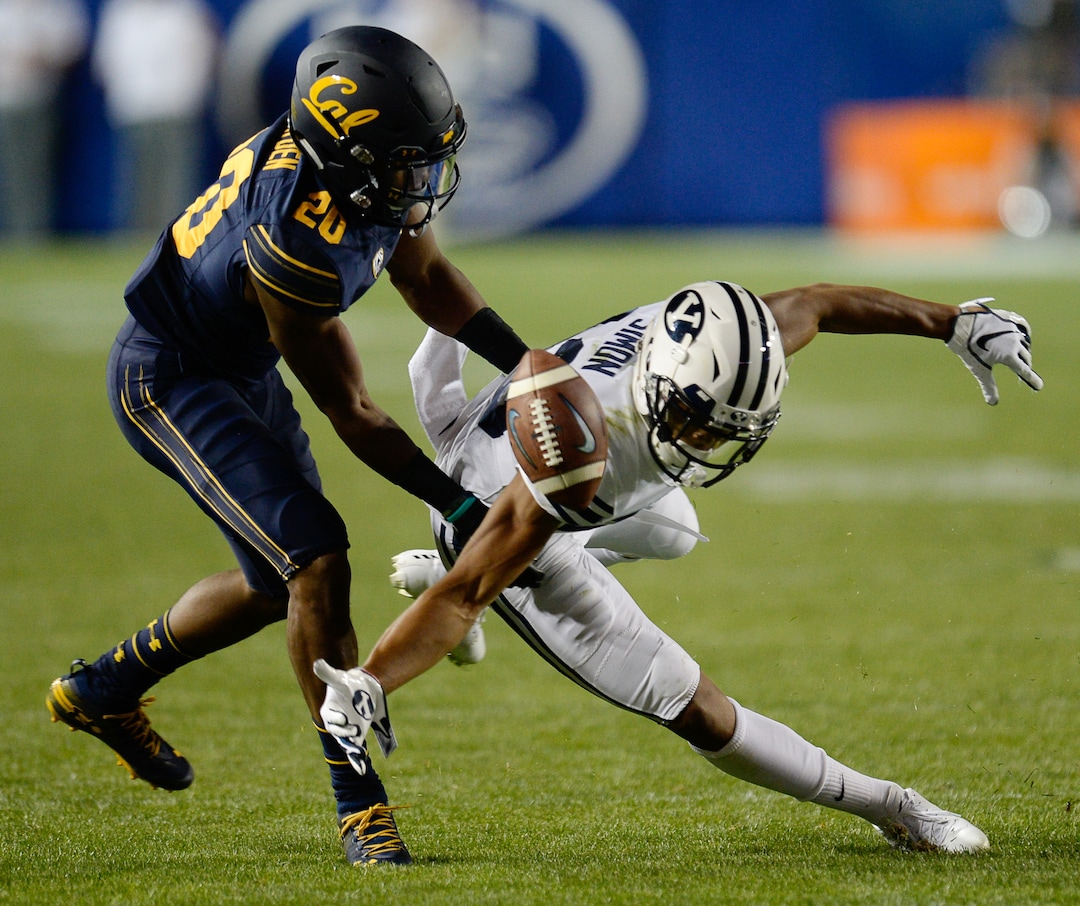 (Francisco Kjolseth  |  The Salt Lake Tribune)  California Golden Bears cornerback Josh Drayden (20) pressures Brigham Young Cougars wide receiver Micah Simon (13) during the second half of the NCAA college football game, Saturday, Sept. 8, 2018, at LaVell Edwards stadium in Provo, Utah.