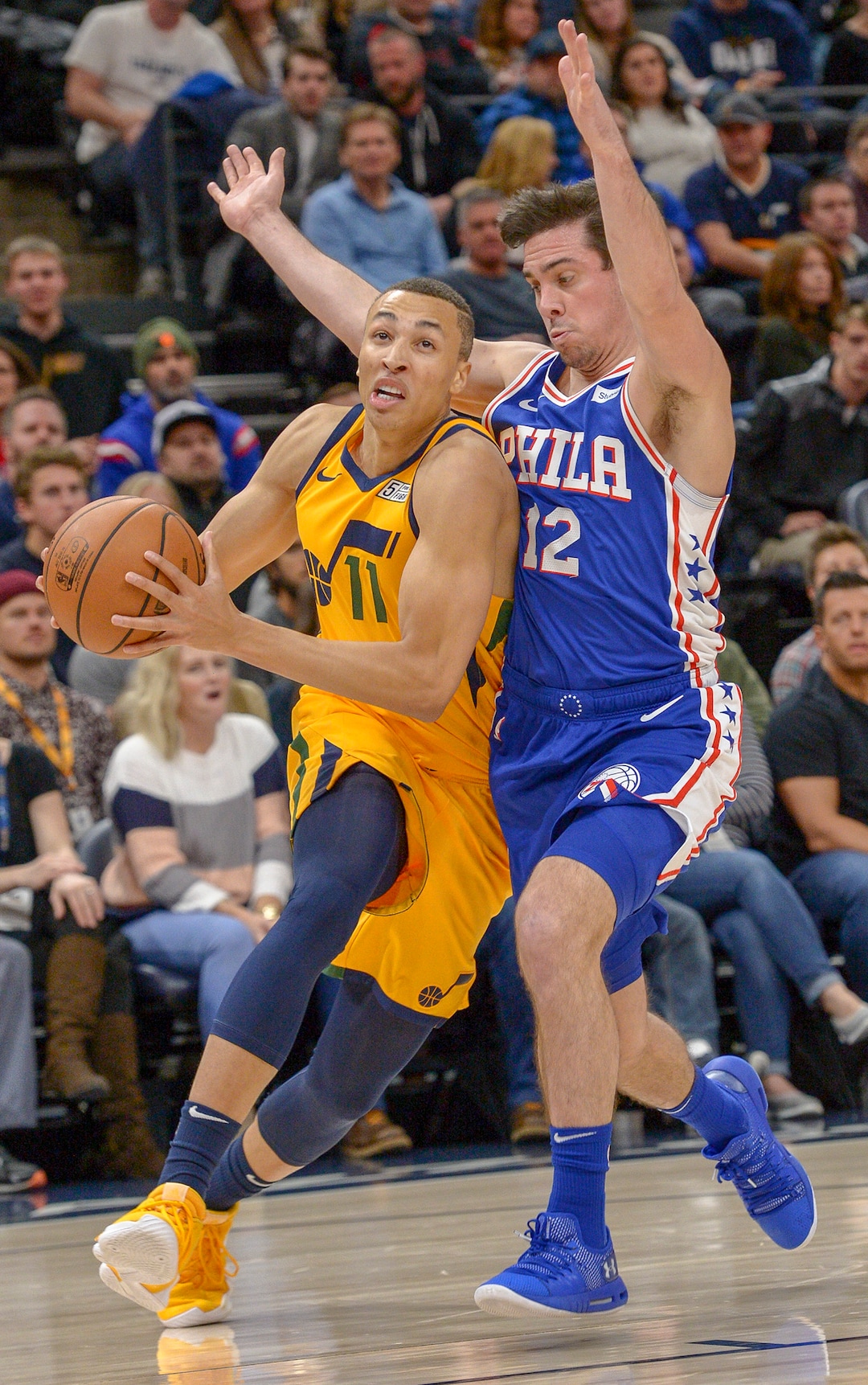 Leah Hogsten  |  The Salt Lake Tribune  Philadelphia 76ers guard T.J. McConnell (12) is charged with a technical on Utah Jazz guard Dante Exum (11) as the Utah Jazz host the Philadelphia 76ers at Vivint Smart Home Arena, Thursday, December 27, 2018. 