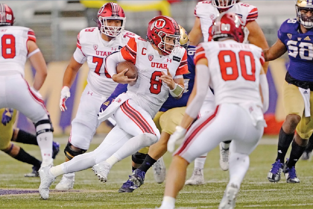 Utah quarterback Jake Bentley (8) keeps the ball against Washington during the first half of an NCAA college football game Saturday, Nov. 28, 2020, in Seattle. (AP Photo/Ted S. Warren)