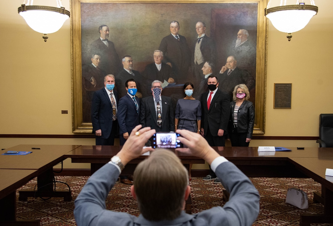 (Francisco Kjolseth  | The Salt Lake Tribune) Utah’s six Republican presidential electors gather for a picture after casting their vote for current President Donald Trump at the Utah State Capitol, Monday, Dec. 14, 2020. Pictured from left are former House Rep. Chris Herrod, Trent Christensen, who ran for Congress in the 4th District, Jimi Kestin, Washington County GOP Chairman, former Congresswoman Mia Love, former Utah House Speaker Greg Hughes and Kris Udy, former Box Elder County Commission candidate. Former Congresswoman Mia Love was filling in as an alternate due to Utah Attorney General Sean Reyes being in quarantine due to the coronavirus.