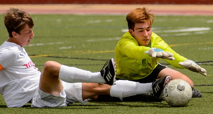 (Trent Nelson | The Salt Lake Tribune)  Maeser Prep goalkeeper Josh Lewis makes a save ahead of Judge Memorial's Jack Terrill (9) in the Class 3A boys' soccer state quarterfinal between Judge Memorial and Maeser Prep in Salt Lake City, Saturday May 5, 2018.