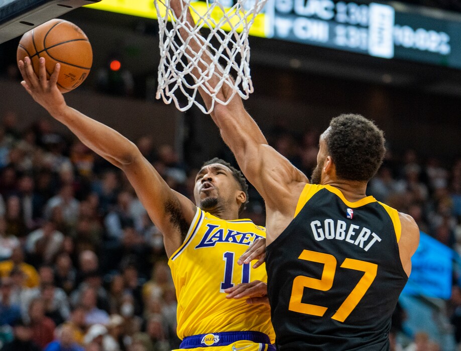 (Rick Egan | The Salt Lake Tribune) Los Angeles Lakers guard Malik Monk (11) goes to the hoop, as Utah Jazz center Rudy Gobert (27) defends, in NBA action between the Utah Jazz and the Los Angeles Lakers, at Vivint Arena, on Thursday, March 31, 2022.