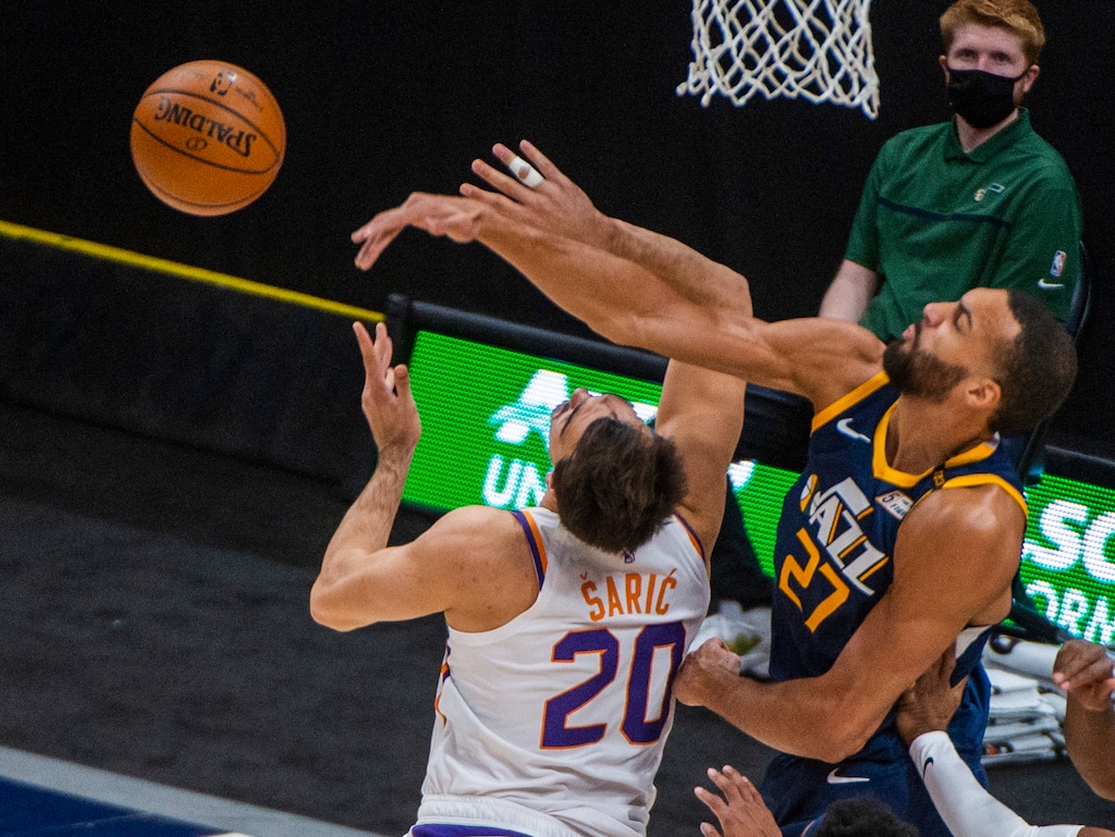 (Rick Egan | The Salt Lake Tribune) Utah Jazz center Rudy Gobert (27) blocks a shot by Phoenix Suns forward Dario Saric (20), in NBA action between the Utah Jazz and the Phoenix Suns, on Thursday, Dec. 31, 2020.