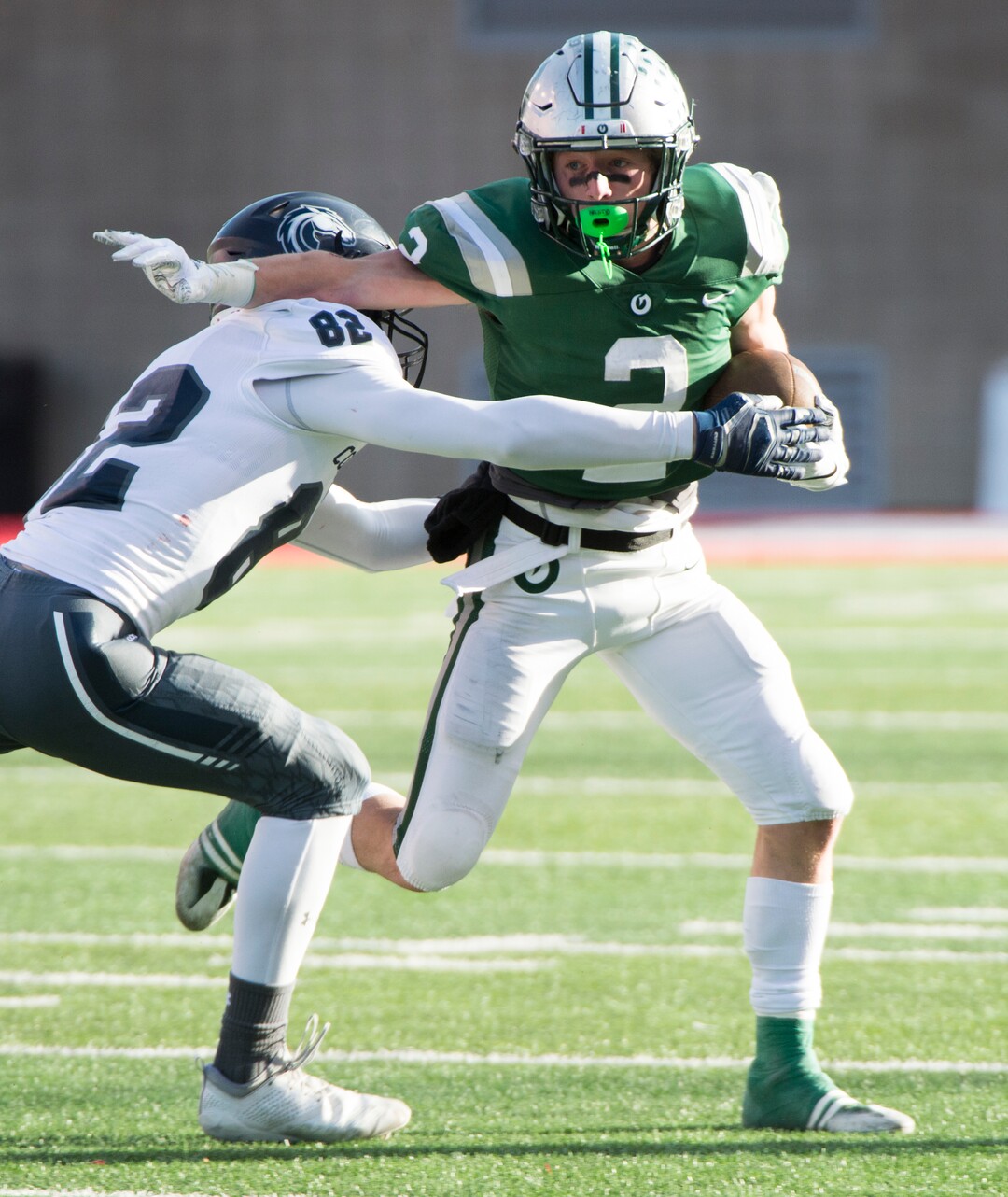 (Rick Egan  |  The Salt Lake Tribune)    Olympus running back Tommy Poulton (2), runs the ball for the Titans, in 5A football semifinal action between Olympus and Corner Canyon at Rice-Eccles Stadium, Thursday, Nov. 8, 2018.