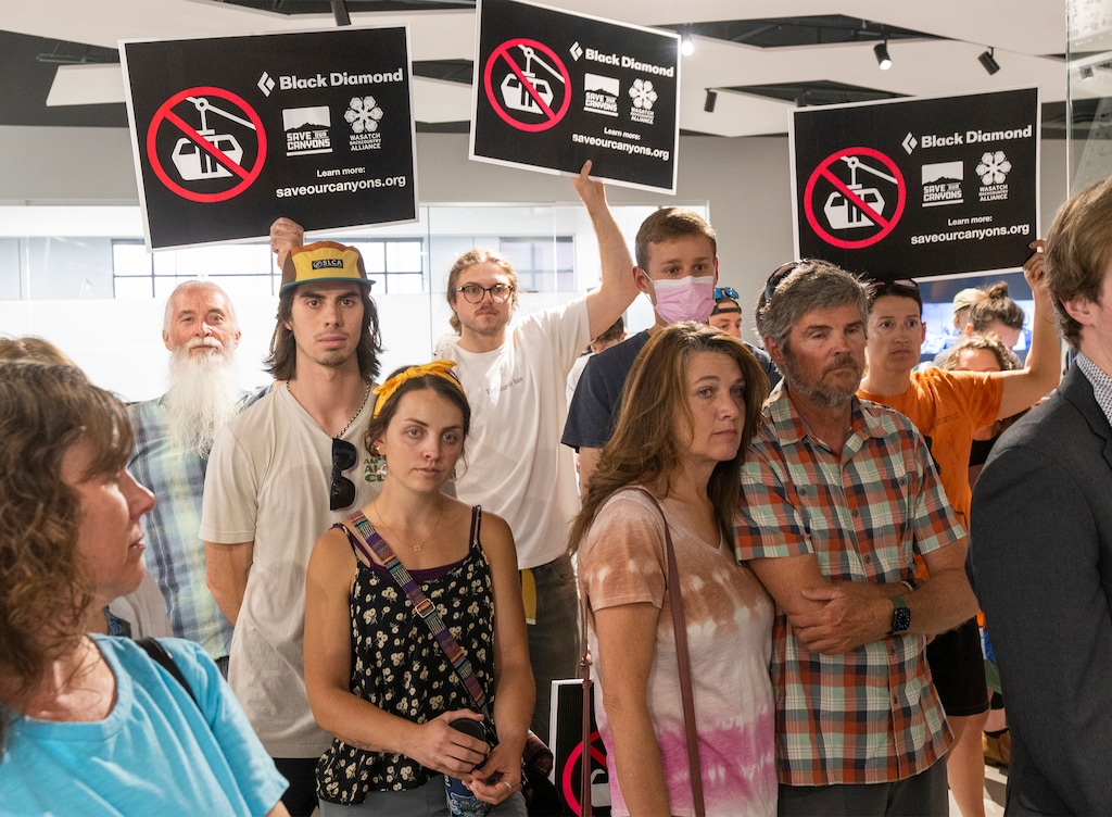(Rick Egan | The Salt Lake Tribune) People against the proposed Little Cottonwood Canyon gondola protest at the Wasatch Front Regional Council meeting on Thursday, May 25, 2023.