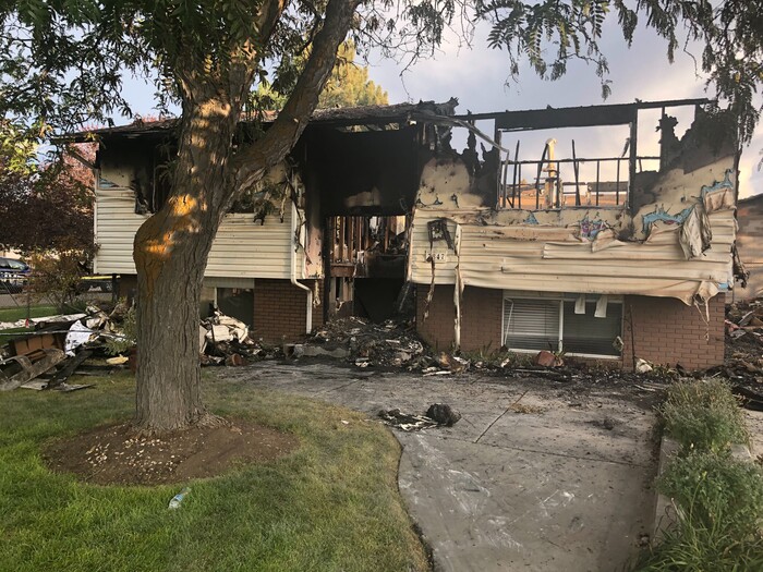 (Sydney Glenn | FOX 13) The crash site where a small plane with six passengers hit a home in West Jordan on Saturday, July 25, 2020.