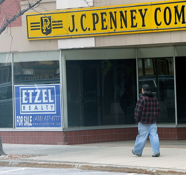 (Al Hartmann | Tribune file photo) A for sale sign is seen in the old J.C. Penny store on Price's Main Street in this 2016 photo. The town, along with many others in rural Utah, have struggled with job losses and in a changing economy.