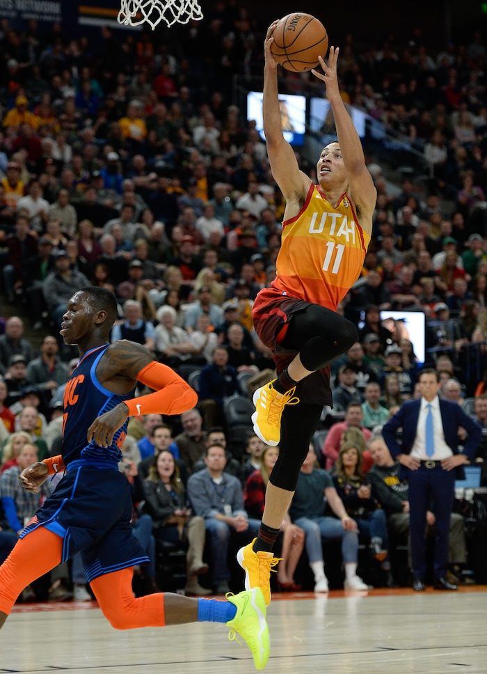 (Francisco Kjolseth  |  The Salt Lake Tribune)   Utah Jazz guard Dante Exum (11) lays one up past the Thunder in the NBA game at Vivint Smart Home Arena Sat., Dec. 22, 2018, in Salt Lake City.